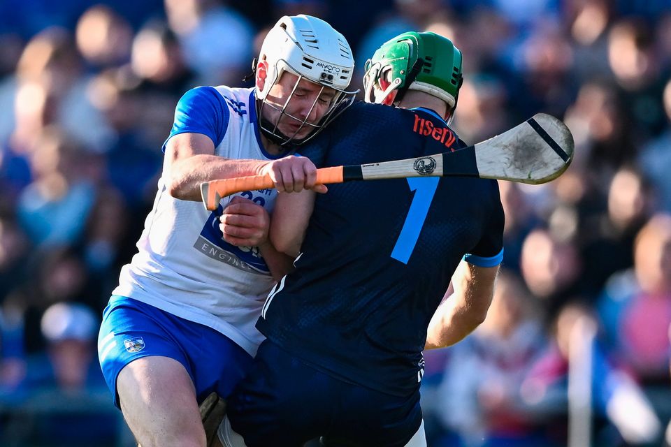 Shane Bennett of Waterford is tackled by Tippeary goalkeeper Barry Hogan in a game that was only shown on GAAGO. Photo: Sportsfile