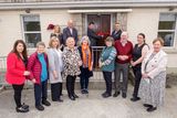 thumbnail: Cllr Pat Kennedy cutting the ribbon on the community hall, with Michael Nicholson of Wicklow County Council, and the Ballinaclash Community Association committee.