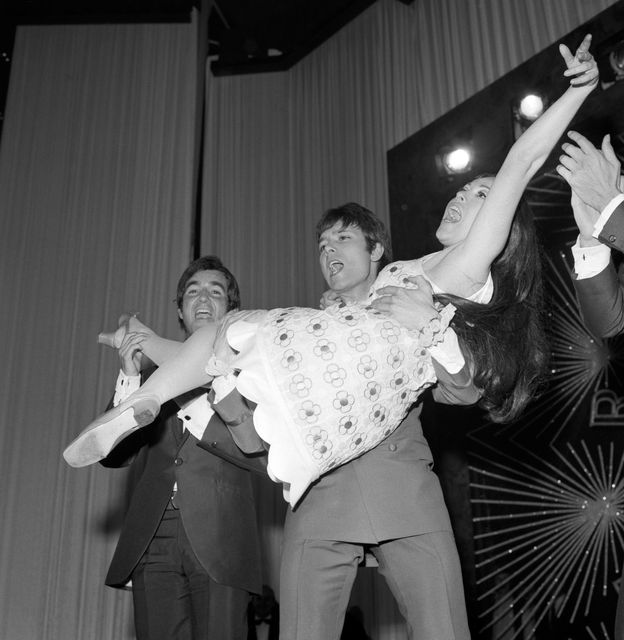 Eurovision runner-up Cliff Richard congratulates winner Massiel at the 1968 contest (PA)