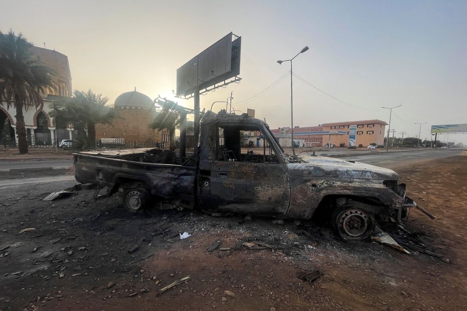 A burned vehicle is seen in Khartoum, Sudan. Photo: Reuters