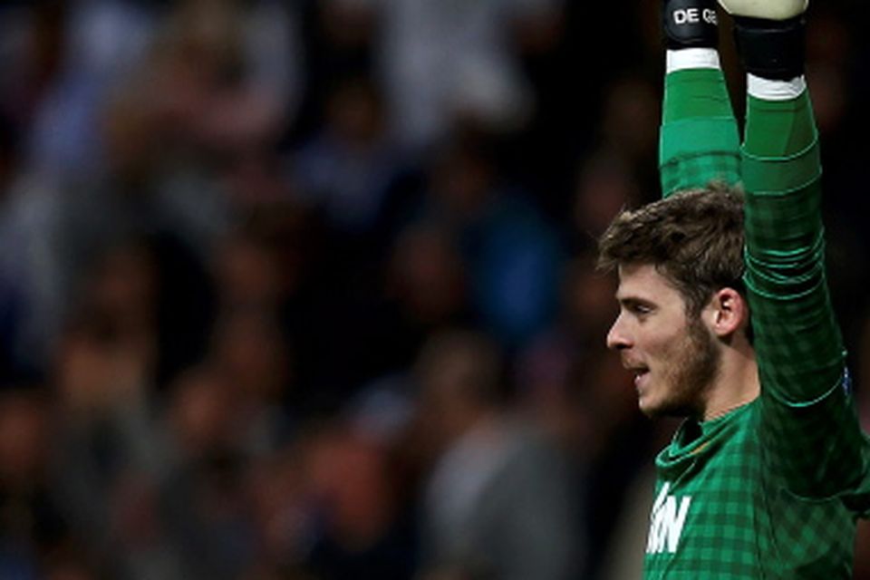 REFILE - CORRECTING SPELLING OF STADIUM

Manchester United's goalkeeper David de Gea celebrates his team's goal against Real Madrid during the Champions League soccer match at Santiago Bernabeu stadium in Madrid February 13, 2013.  REUTERS/Susana Vera (SPAIN - Tags: SPORT SOCCER)