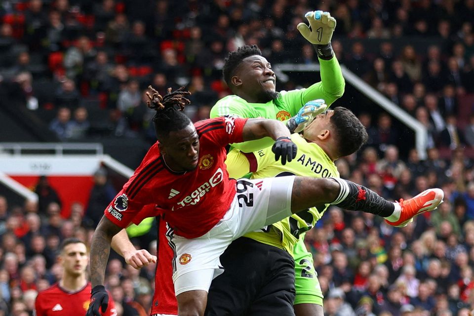 Andre Onana clatters into Zeki Amdouni to concede the penalty from which Burnley equalised. Photo: Carl Recine/Reuters