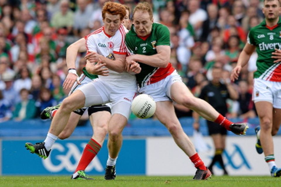 Tyrone's Peter Harte and Tom Cunniffe clash shoulder to shoulder