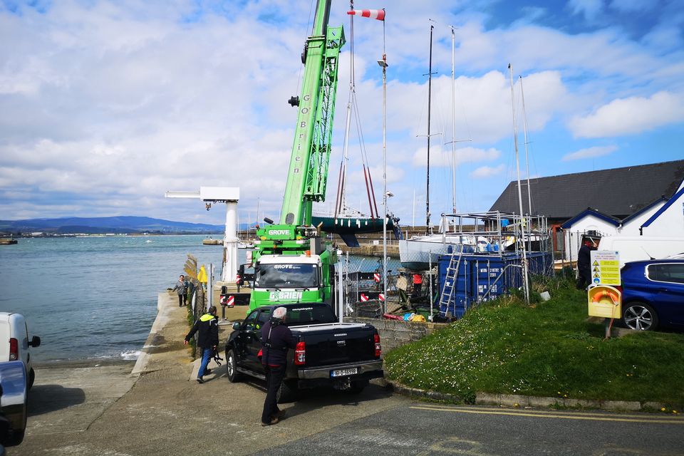 A crane lifting boats from the boat yard at Wicklow Sailing Club in preparation for the start of the sailing season.