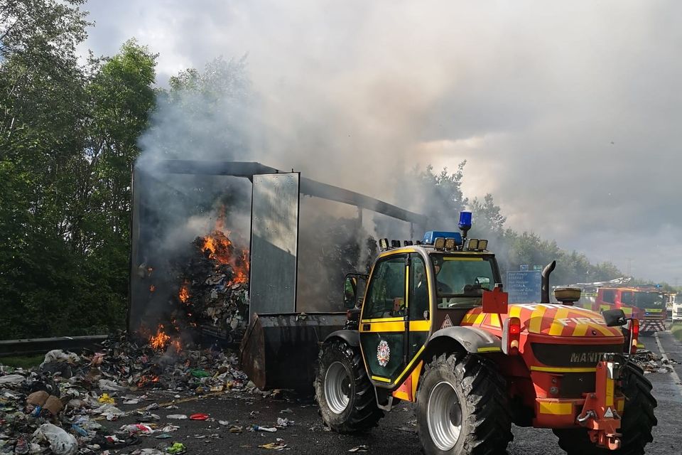 Dublin Fire Brigade's Manitou teleporter has been used to remove the burning waste so it can be extinguished and cooled. Photo: DFB.