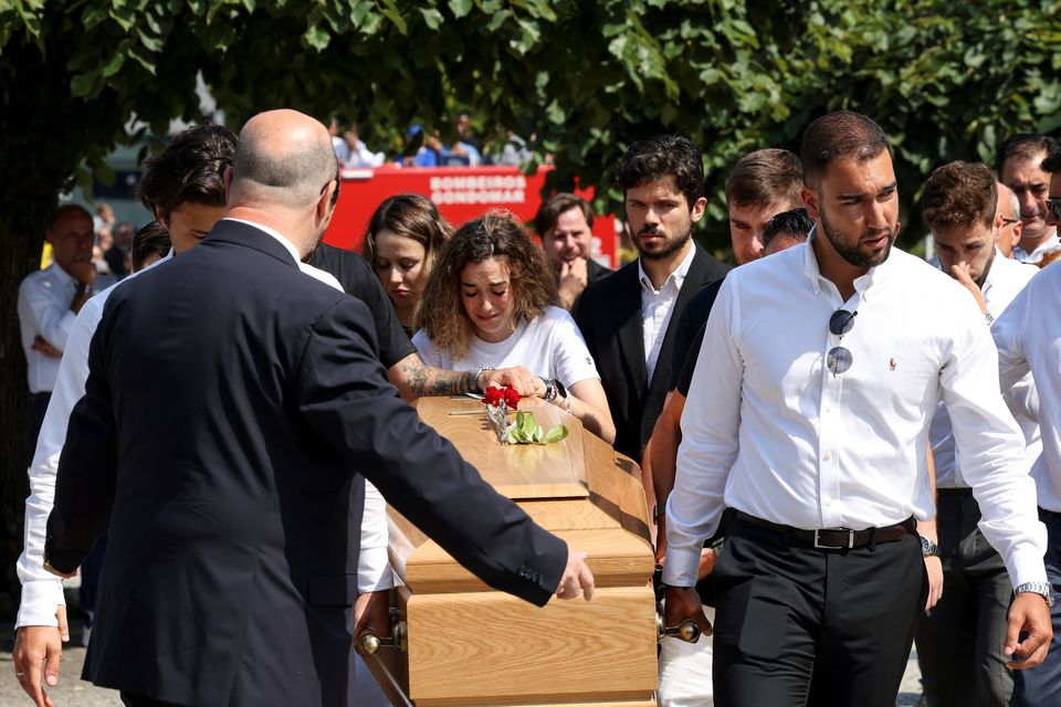 Rute Cardoso weeps on the coffin of her late husband Diogo Jota. Photo: Reuters