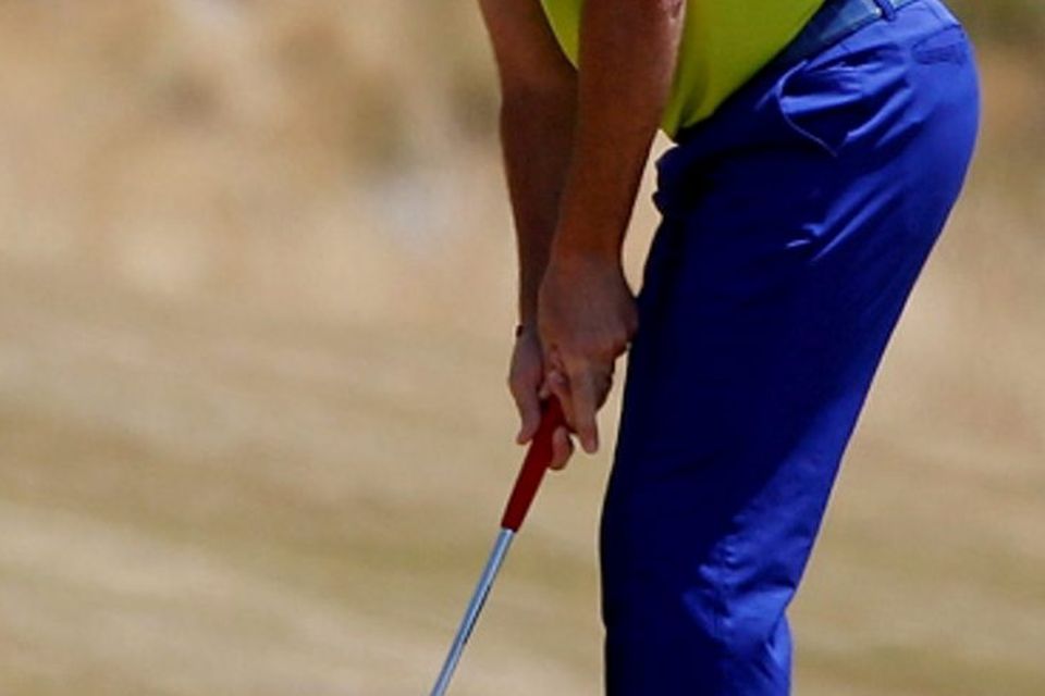 Ian Poulter, of England, putts on the first hole during the final round of the U.S. Open golf tournament at Chambers Bay on Sunday, June 21, 2015 in University Place, Wash. (AP Photo/Lenny Ignelzi)
