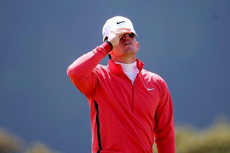 Rory McIlroy reacts to a missed putt