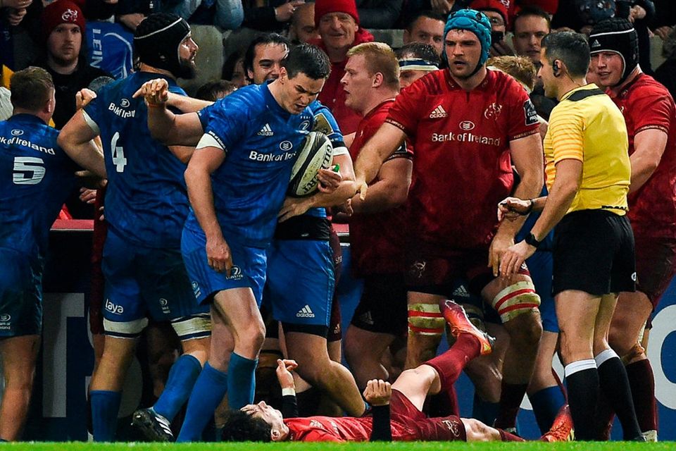 Sexton leaves his Munster rival on the ground in last December’s derby clash. Photo: Diarmuid Greene/Sportsfile