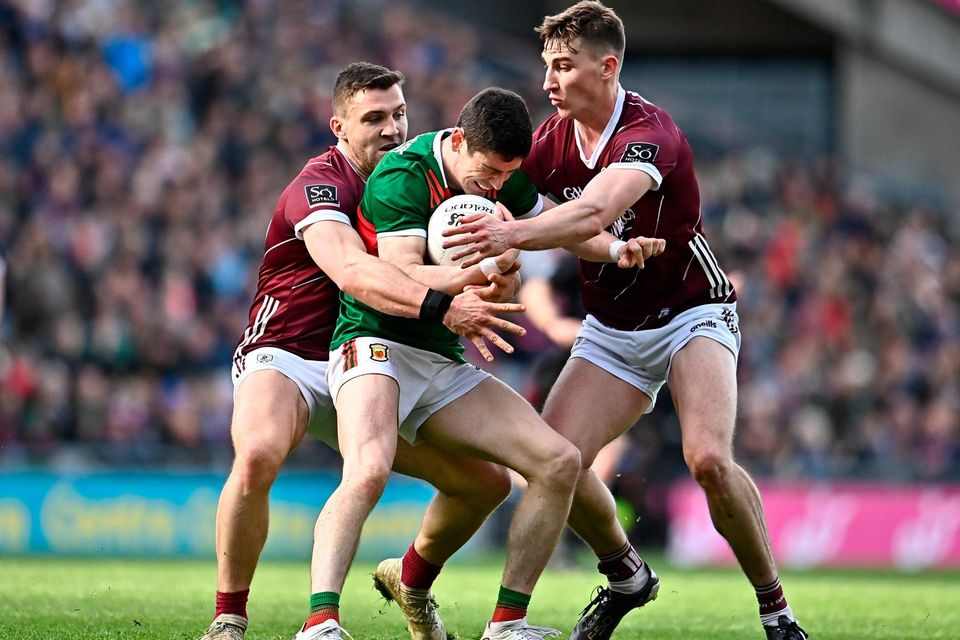 Conor Loftus of Mayo in action against Damien Comer and Matthew Tierney of Galway. Photo: Sam Barnes/Sportsfile