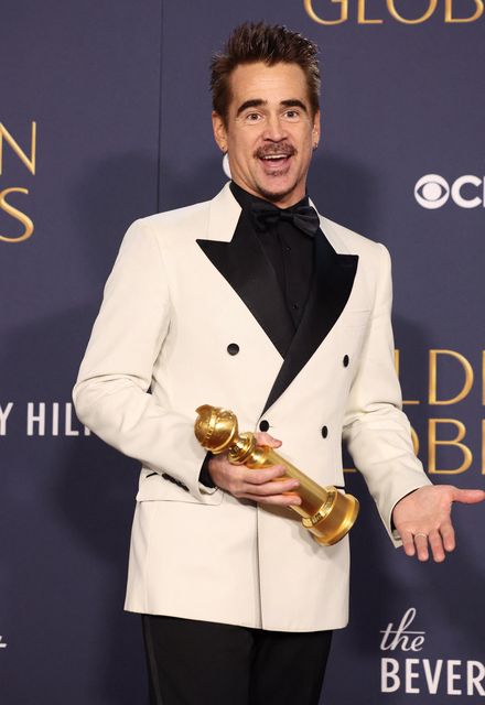 Colin Farrell poses with his award for Best Performance by an Actor in a Limited Series. REUTERS/Mario Anzuoni