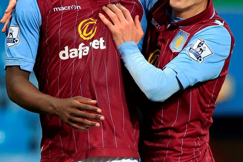 Aston Villa's Christian Benteke (left) celebrates scoring his side's second goal of the game with teammate Jack Grealish (right) during the Barclays Premier League match at Villa Park, Birmingham. PRESS ASSOCIATION Photo. Picture date: Tuesday April 7, 2015. See PA story SOCCER Villa. Photo credit should read: Nick Potts/PA Wire. RESTRICTIONS: Editorial use only. Maximum 45 images during a match. No video emulation or promotion as 'live'. No use in games, competitions, merchandise, betting or single club/player services. No use with unofficial audio, video, data, fixtures or club/league logos.