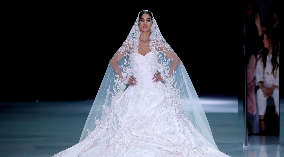 Is this the designer behind Meghan Markle s 100 000 wedding dress