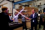 thumbnail: Prince Harry (L) and Prince William, Duke of Cambridge try out light sabres during a tour of the Star Wars sets at Pinewood studios on April 19, 2016  in Iver Heath, England.  (Photo by Adrian Dennis-WPA Pool/Getty IMages)