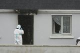 thumbnail: Investigators examine the house at which John Brogan was found dead at Pheasanthill, Castlebar, Co Mayo. Photo: Padraig O'Reilly