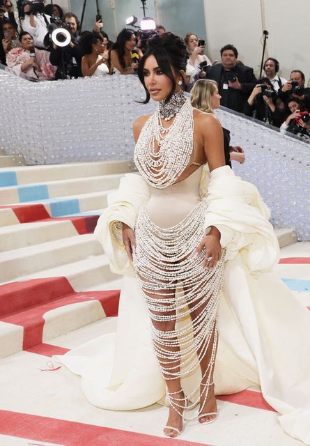 Kim Kardashian poses at the Met Gala, an annual fundraising gala held for the benefit of the Metropolitan Museum of Art's Costume Institute with this year's theme "Karl Lagerfeld: A Line of Beauty", in New York City, New York, U.S., May 1, 2023. REUTERS/Andrew Kelly