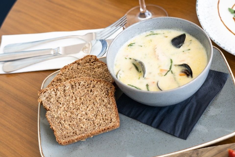 Rear: Mediterranean Seabass, Roast Fennel, Baby Potatoes, Front: Lighthouse Creamy Seafood Chowder. The Lighthouse. Photo: Lucinda O'Sullivan