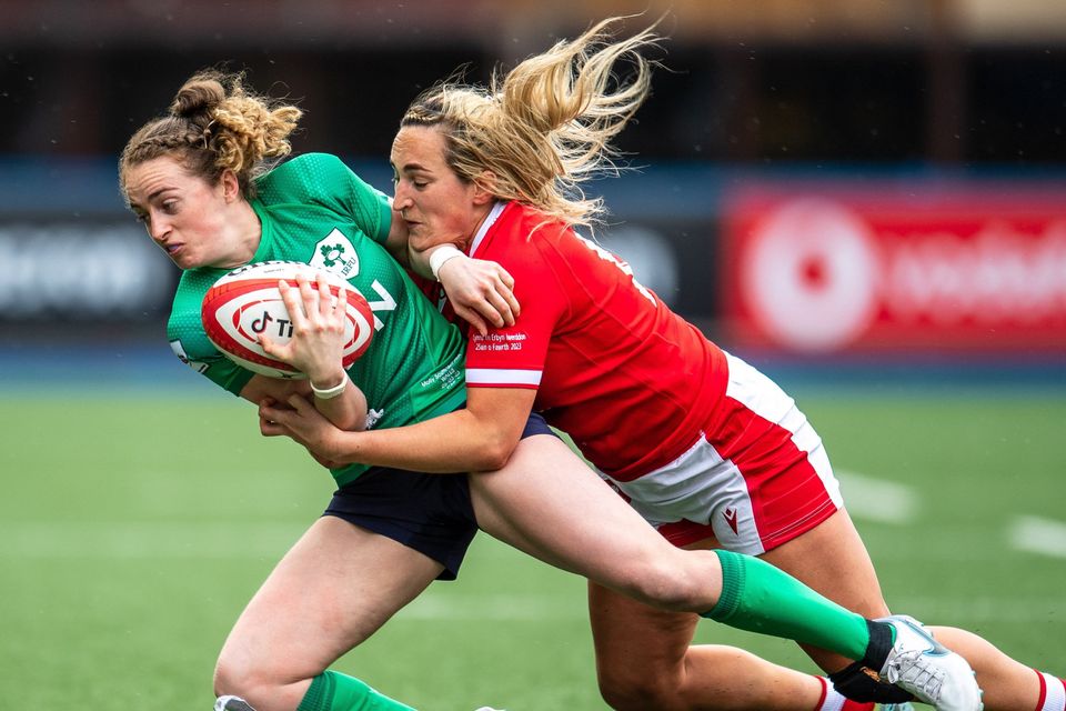 Molly Scuffil-McCabe is tackled by Courtney Keight of Wales. Photo by Mark Lewis/Sportsfile