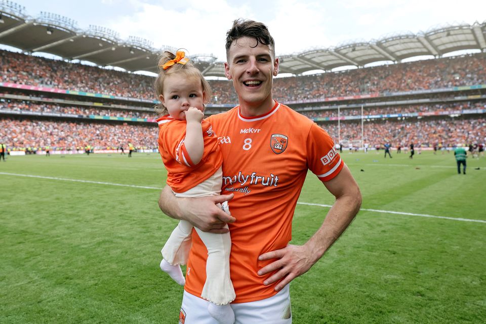 Niall Grimley with daughter Olivia, following Armagh's victory over Galway in the All-Ireland GAA Senior Football Final, 2024. Photo: Laszlo Geczo/INPHO