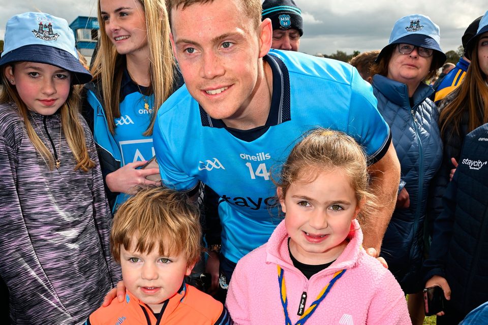 Dublin captain Con O'Callaghan poses with four-year-old Dáithí and six-year-old Penny Redmond from Annacurra in Wicklow after the Leinster quarter-final. Photo:  Ray McManus/Sportsfile