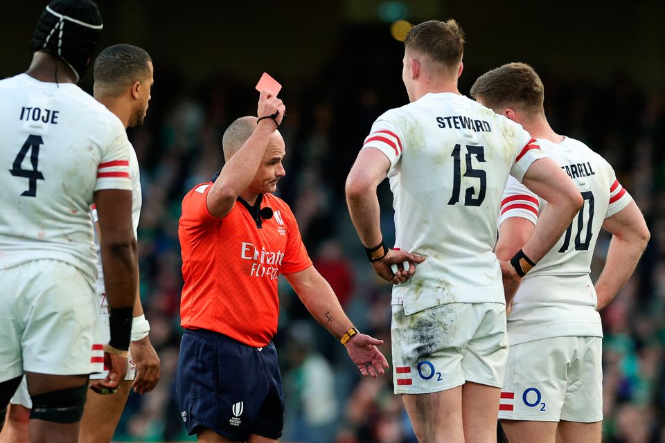 Referee Freddie Steward of England receives a red card from referee Jaco Peyper during the Six Nations defeat to Ireland