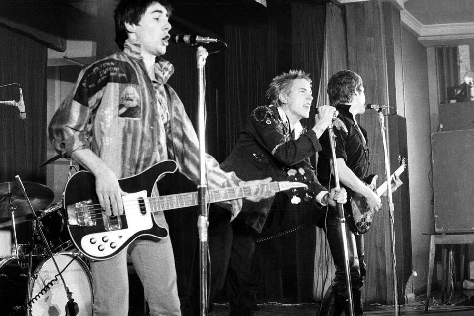 From left, Glen Matlock, Johnny Rotten and Steve Jones of the Sex Pistols on stage in 1976. Photo by Ian Dickson/Redferns