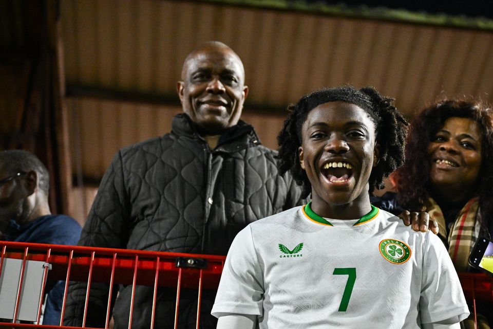 Jaden Umeh with parents Jerry and Catherine after an U-17 international last year. Photo: Ben McShane/Sportsfile