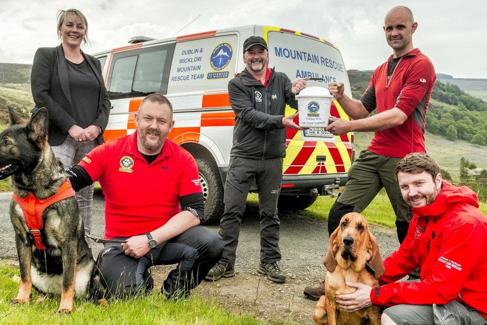 Lorna Kelly (Luggala Estate Executive Administrator); Maurice Brady (DWMRT Team Leader) with search Dog Layla; Terry Byrne (DWMRT Chairperson); Michael Keegan (Luggala Estate Farm Manager); Philip McRory (DWMRT Team Member and Dog Handler) with search dog Grace.