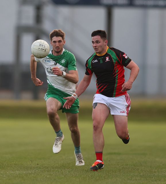 Pat Burke from Baltinglass chases Kiltegan's Adam Wynne. 