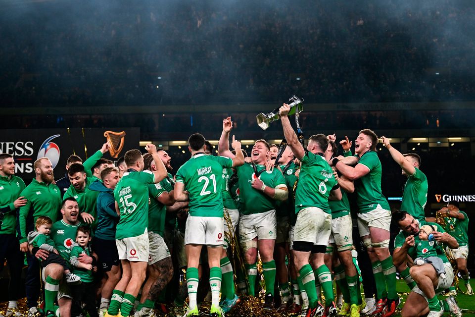 Ireland players celebrate with the Six Nations trophy