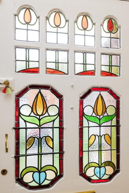 Stained-glass windows in the front doorway