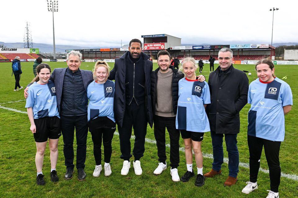 Rio Ferdinand and Westlife's Shane Filan with (from left) Megan Rooney from Leitrim, chair of the IFI Paddy Harte, Phoebe Wallace from Enniskillen, Amy Malone from Leitrim, Dara Calleary TD, the Republic's Minister of State in the Department of Enterprise, Trade and Employment, and Molly Nixon from Enniskillen