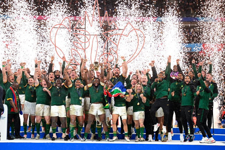 Siya Kolisi of South Africa lifts The Webb Ellis Cup following the Rugby World Cup final win over New Zealand. (Photo by Hannah Peters/Getty Images)