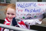 thumbnail: A girl holds a placard as U.S. President Joe Biden visits Dundalk, Ireland, April 12, 2023. REUTERS/Kevin Lamarque