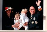 thumbnail: Prince Albert II of Monaco (R) holding Prince Jacques, and princess Charlene of Monaco (L) holding Princess Gabriella, appear on the balcony of the Monaco Palace during the celebrations marking Monaco's National Day