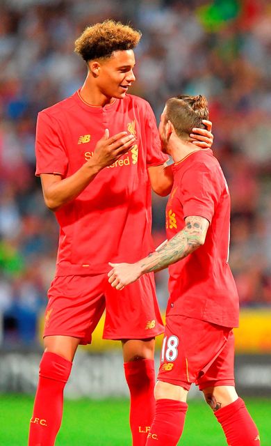 Liverpool's Alberto Moreno (right) is congratulated on scoring his team's second goal by team mate Shamal George during the pre-season friendly match at John Smith's Stadium, Huddersfield