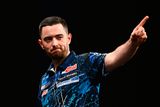 thumbnail: Luke Humphries celebrates scoring a '180' during his match against Peter Wright at the BetMGM Premier League Darts at the 3Arena in Dublin