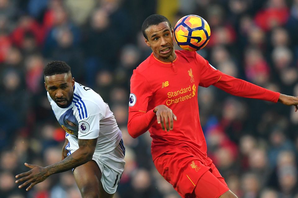 Joel Matip, right, in action for Liverpool