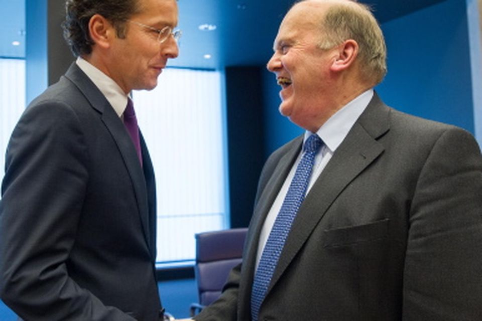 Eurogroup chairman Jeroen Dijsselbloem talking to Finance Minister Michael Noonan during the eurozone finance ministers meeting in Luxembourg