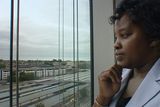 thumbnail: Namucana Nyambe, originally from Zambia, looking out of an office in Dublin