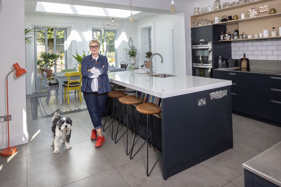 Amo & Pax owner Amanda Pratt with her Tibetan terrier Tenzing - she also has a bichon frise, Yumiko - in the kitchen of her 19th century home in south county Dublin. Photo: Tony Gavin