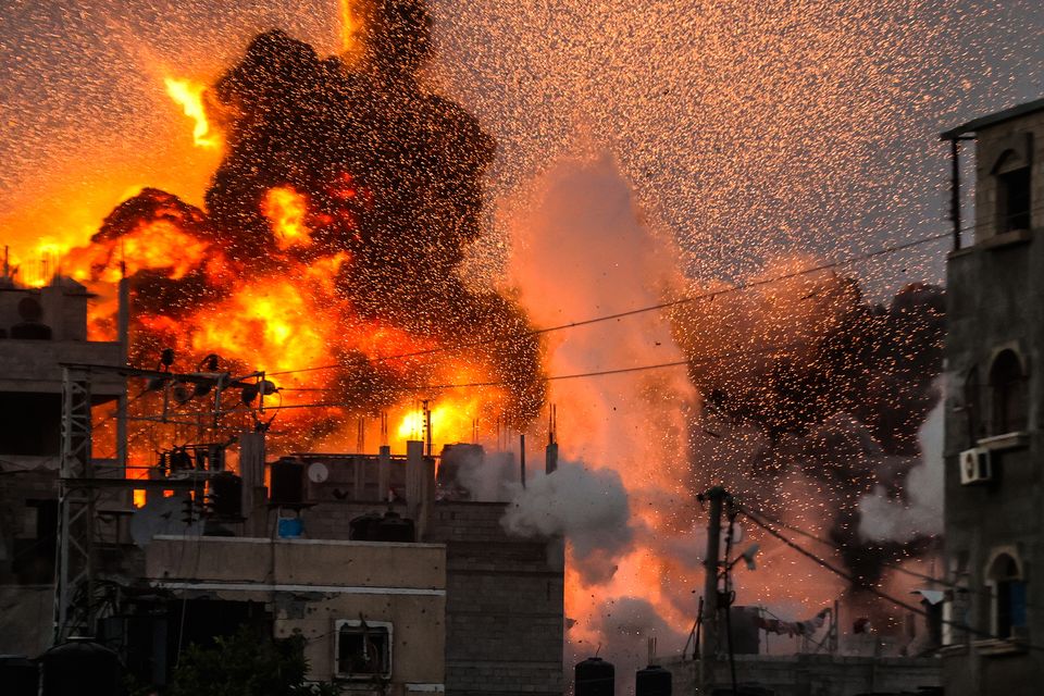 Smoke and flames rise over a destroyed building following an Israeli attack on Al Bureij Camp in Deir al-Balah, Gaza. Photo: Ali Jadallah/Anadolu via Getty Images.