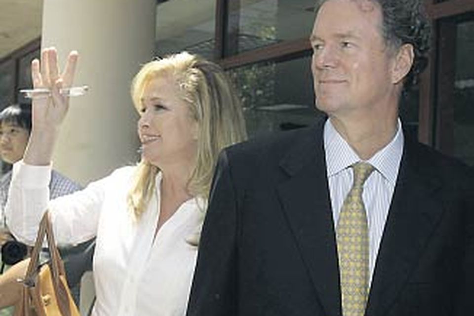 Kathy and Rick Hilton leave after visiting a distraught Paris