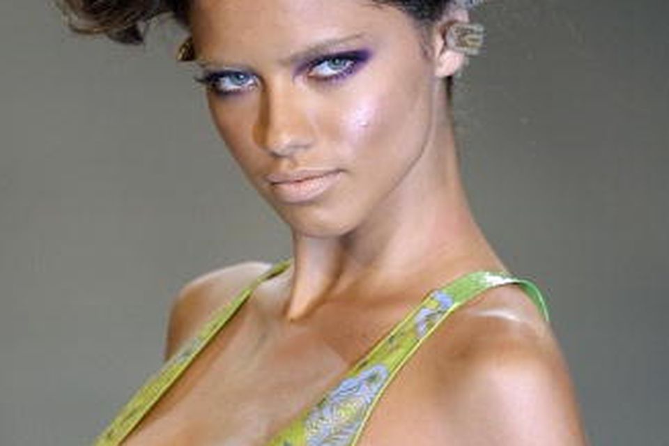Adriana Lima Wears a Brazil Soccer Jersey At Couture Fashion Week