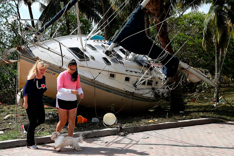 A boat washed ashore at the Dinner Key marina. Photo: Getty Images
