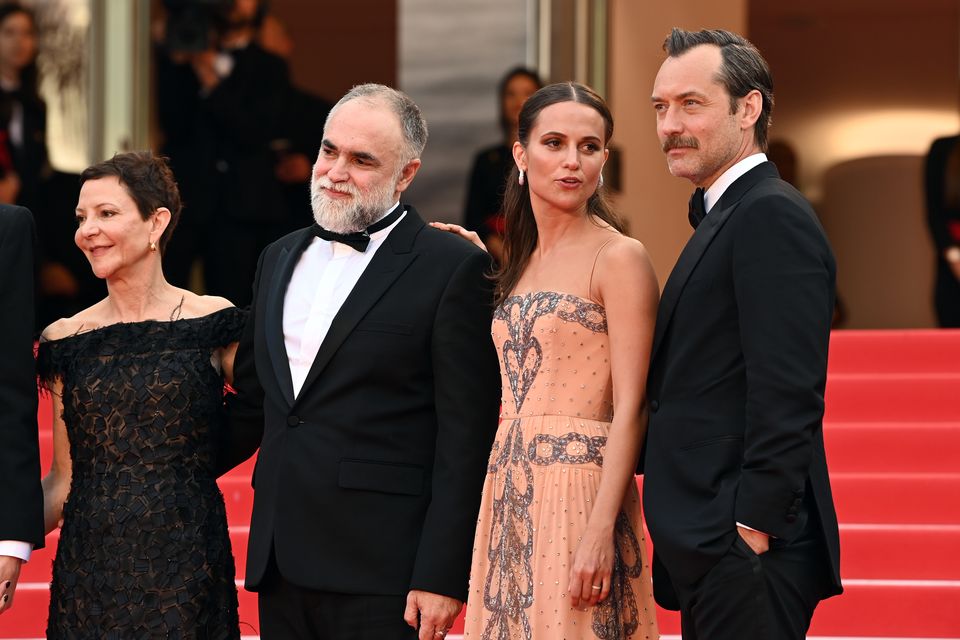Gabrielle Tana, Karim Ainouz, Alicia Vikander and Jude Law attending the Firebrand premiere during the 76th Cannes Film Festival (Doug Peters/PA)