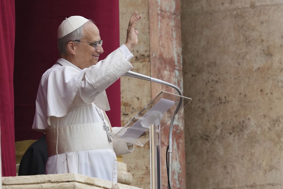 Pope Leo XIV appears at the central balcony of St Peter’s Basilica for his first Sunday blessing after his election (Domenico Stinellis/AP)