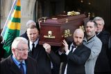 thumbnail: The remains of Journalist Michael O'Regan are brought from The Holy Cross Church in Dundrum following his funeral mass. Photo: Steve Humphreys
