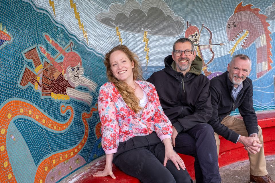 Artists Donna Carroll, Jay Roche and John Carter with their mosaic in the shelter on Bray seafront. Photo: Leigh Anderson.