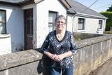 thumbnail: Concerned neighbour Veronica Houlihane who resides in the house on the right in the picture. Mrs Hourihane's house is adjoined to the derelict house in Old Garden City. Pic: Jim Campbell